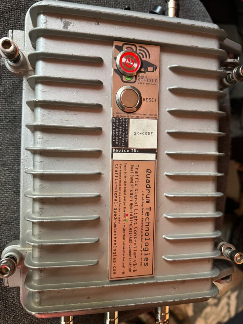 QT-TSLC v1.1 wireless traffic light controller &mdash; product label showing model, brand, and monitoring-portal URL