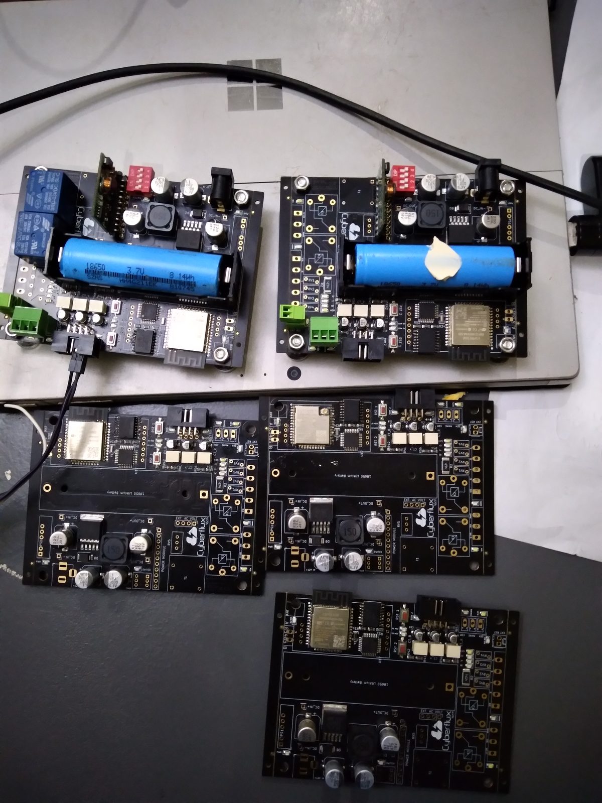SmartSAV v1.0 &mdash; multiple populated boards on the bench (Cyberflux)